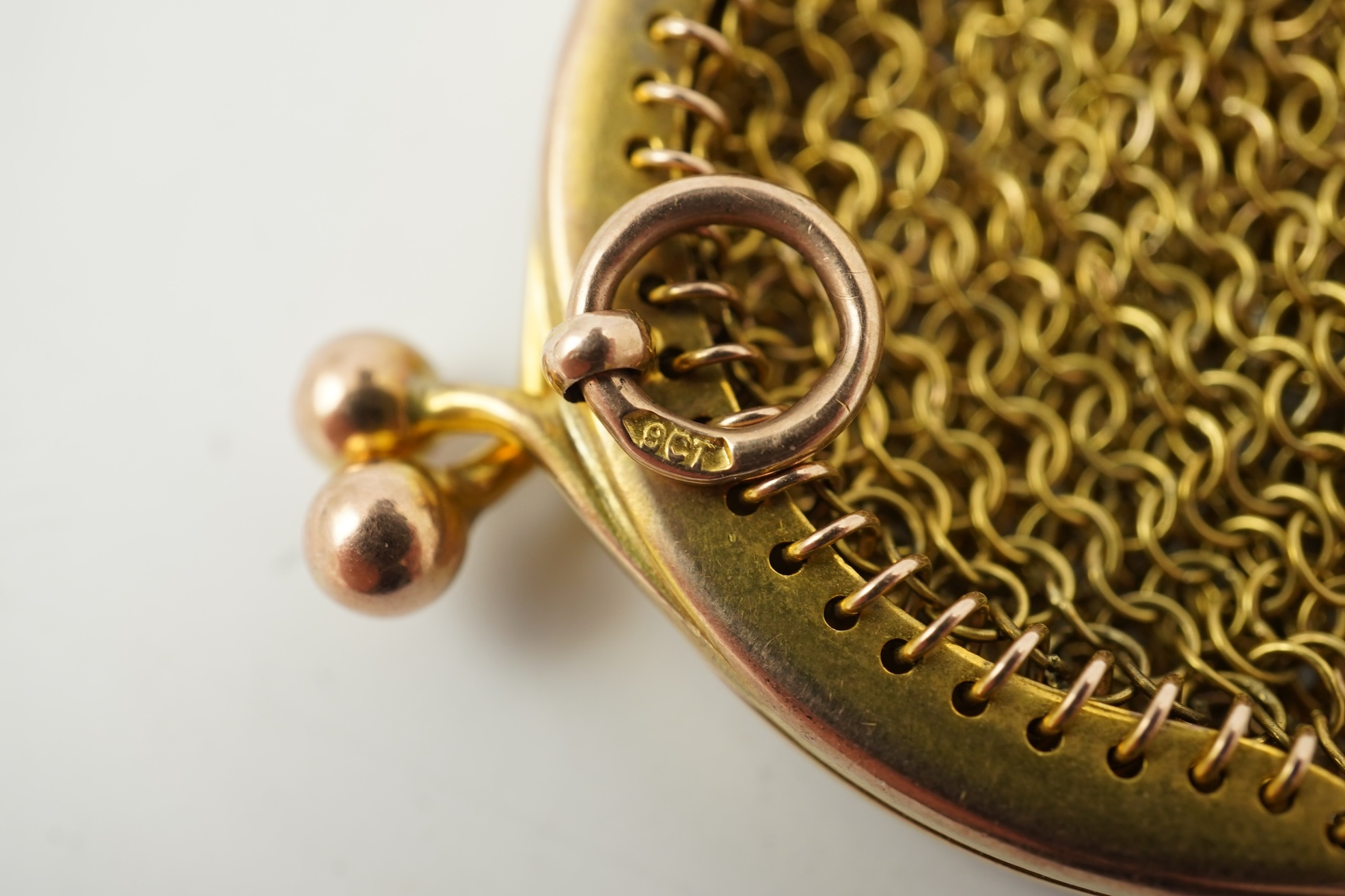 A small early 20th century 9ct gold mesh purse